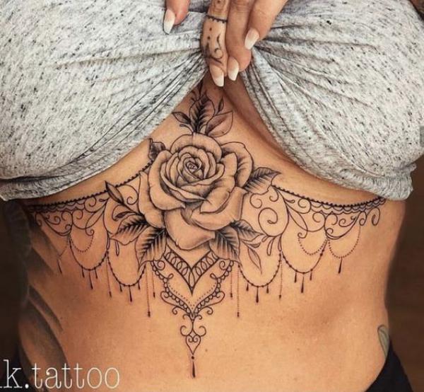 Feminine rose with pendant underboob tattoo