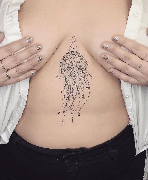 Fine line jellyfish sternum tattoo
