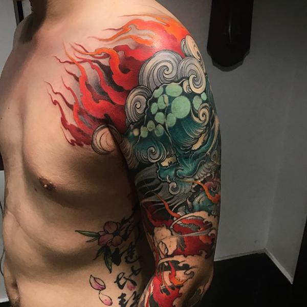 Flaming foo dog half sleeve tattoo