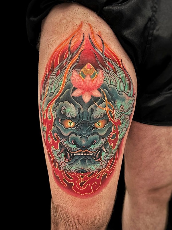 Flaming foo dog thigh tattoo