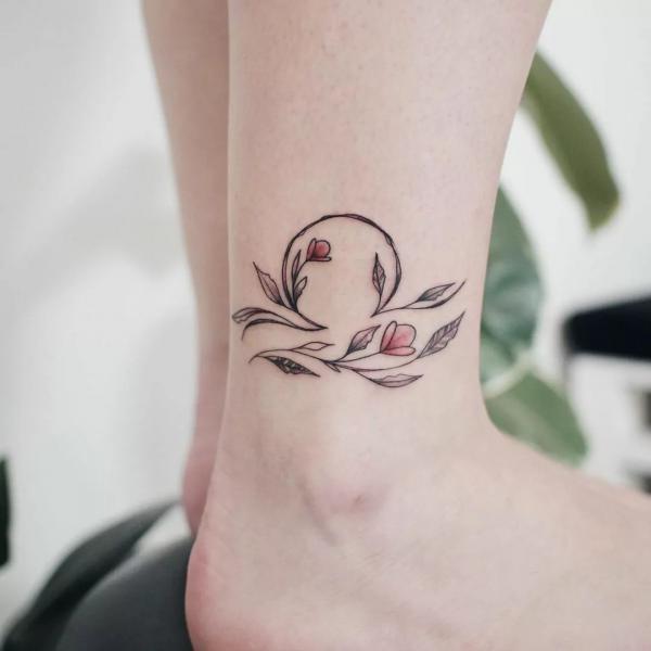 Floral Libra sign ankle tattoo