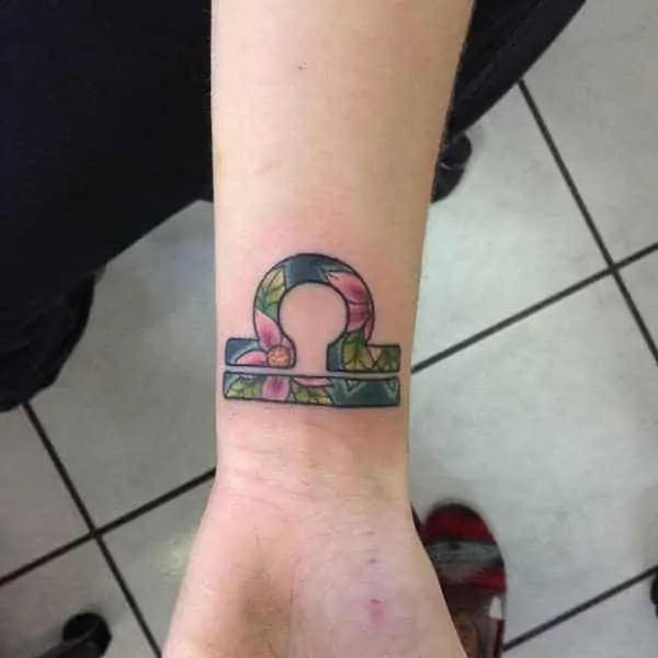 Floral Libra wrist tattoo