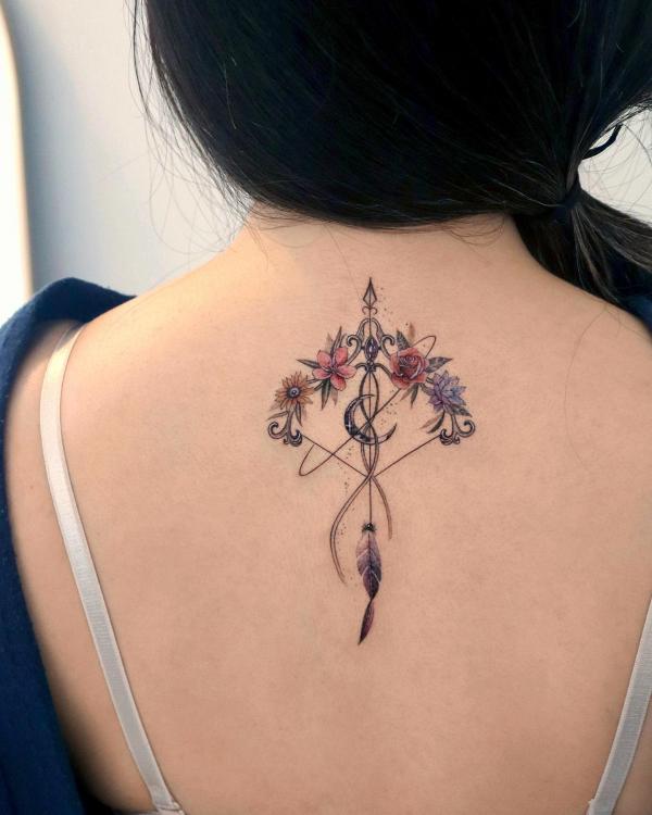 Floral sagittarius bow and arrow with crescent back tattoo