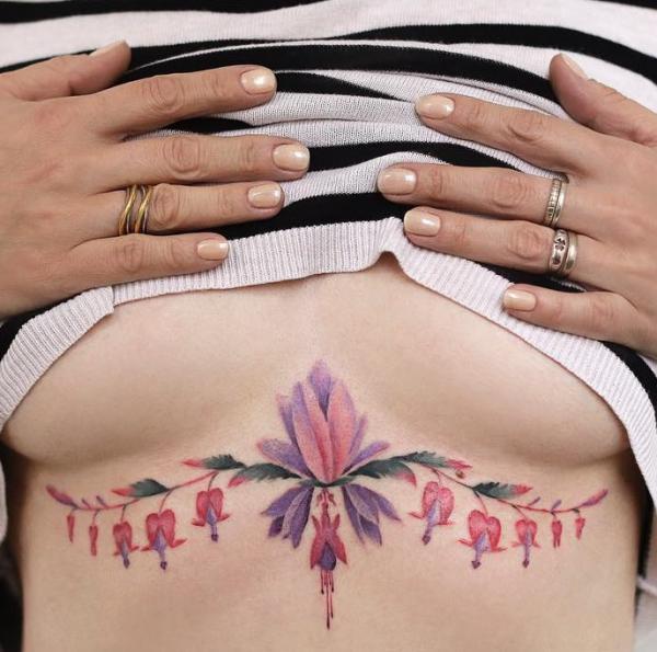 Floral sternum tattoo