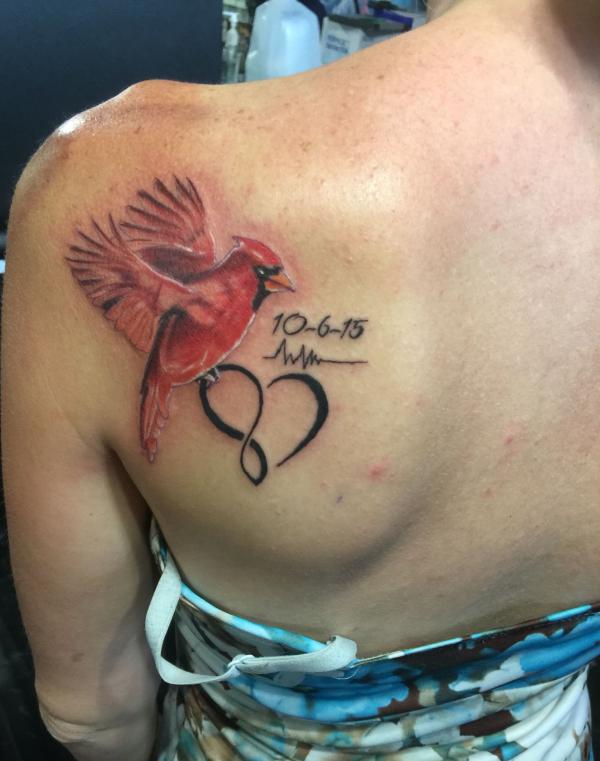 Flying cardinal with heart heartbeat and date tattoo