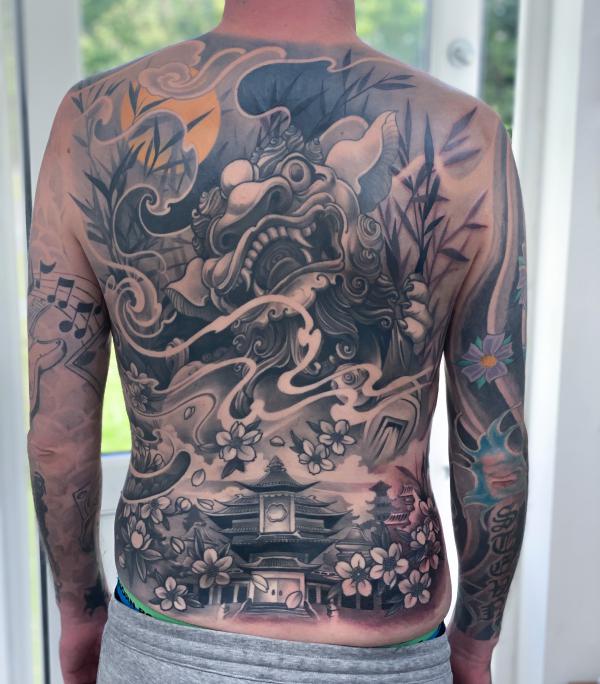 Flying foo dog and temple with cherry blossom tattoo