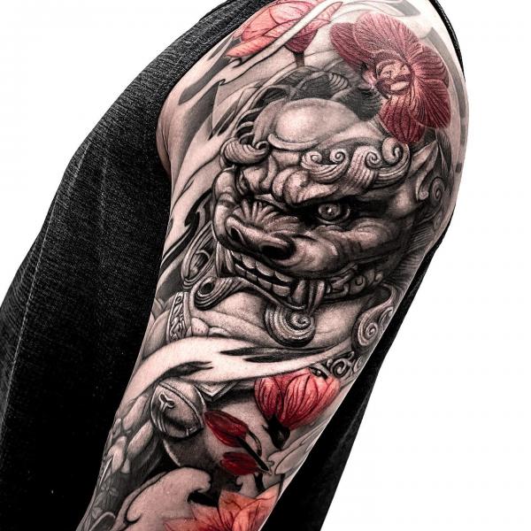 Foo Dog with red orchids