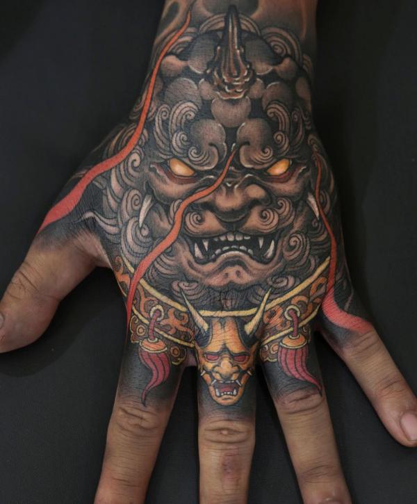 Foo dog and Oni hand tattoo