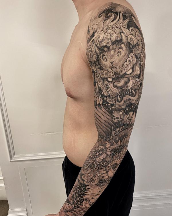 Foo dog and Phoenix on full sleeve tattoo