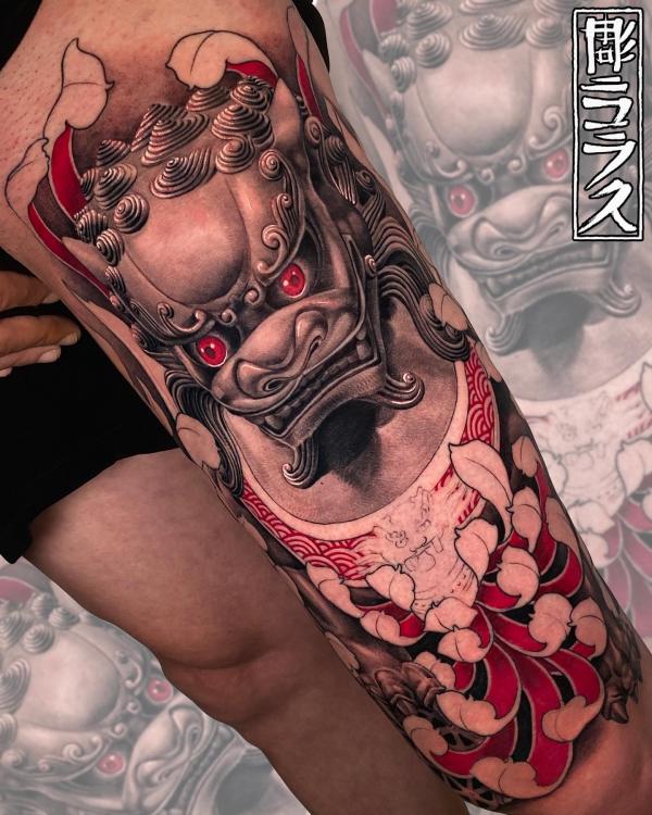Foo dog and chrysanthemum leg tattoo