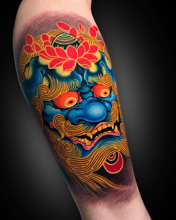 Foo dog and lotus tattoo forearm