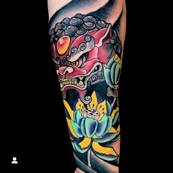 Foo dog and lotus tattoo