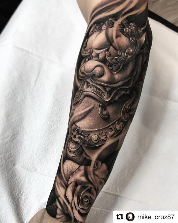 Foo dog and rose tattoo