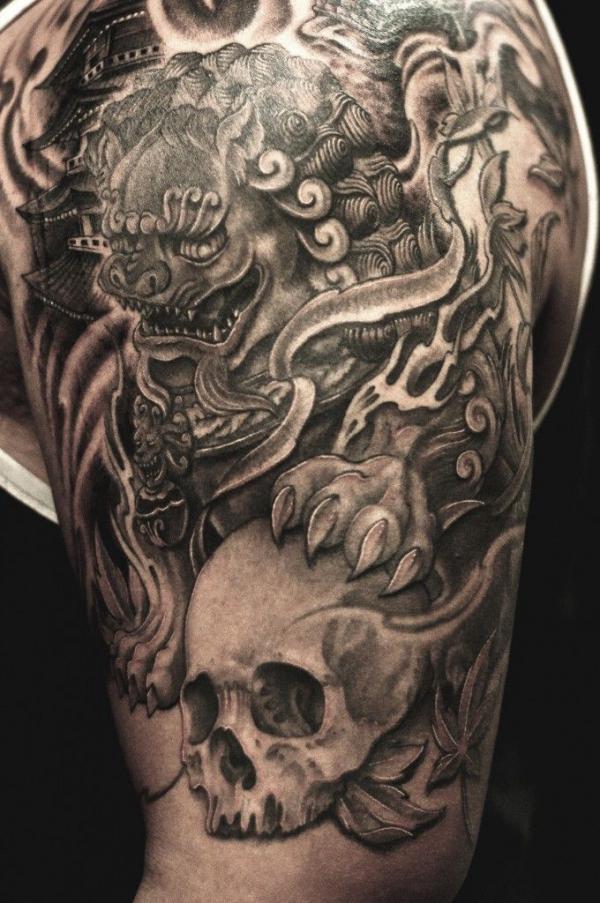Foo dog and skull tattoo