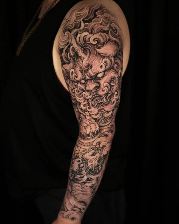 Foo dog and tiger sleeve tattoo