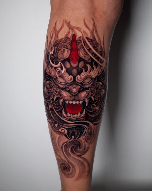 Foo dog calf tattoo