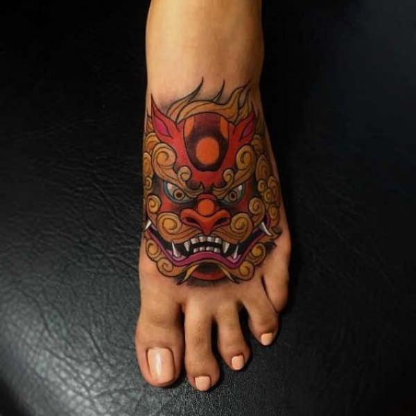 Foo dog foot tattoo