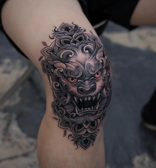 Foo dog knee tattoo