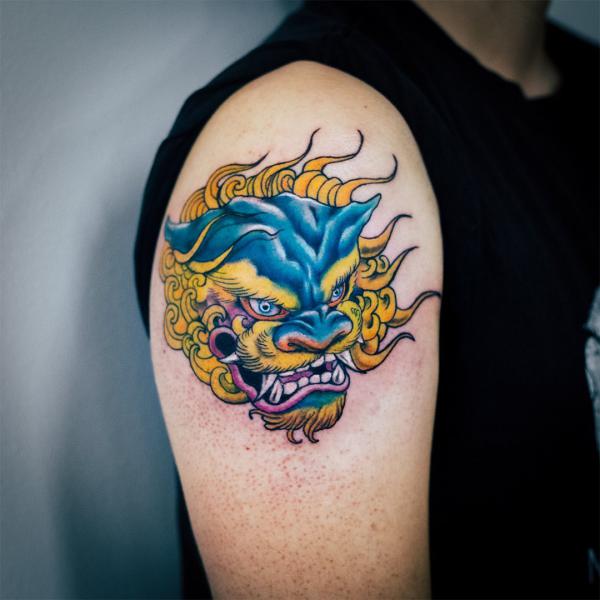 Foo dog shoulder tattoo