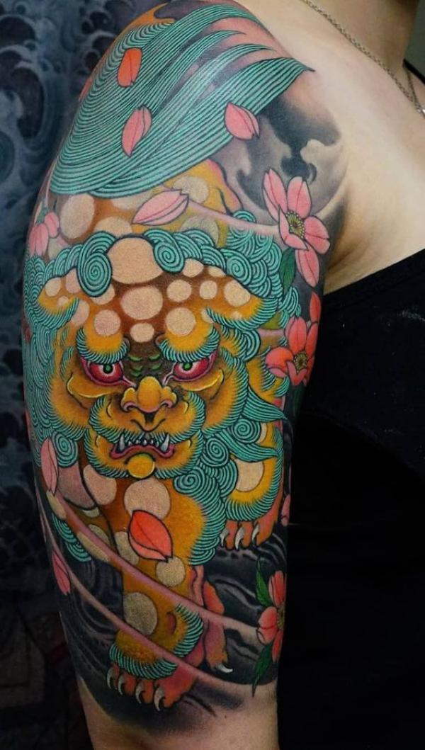 Foo dog with cherry blossom half sleeve tattoo