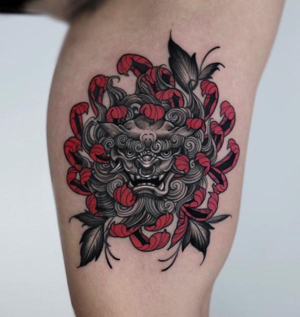 Foo dog with chrysanthemum tattoo