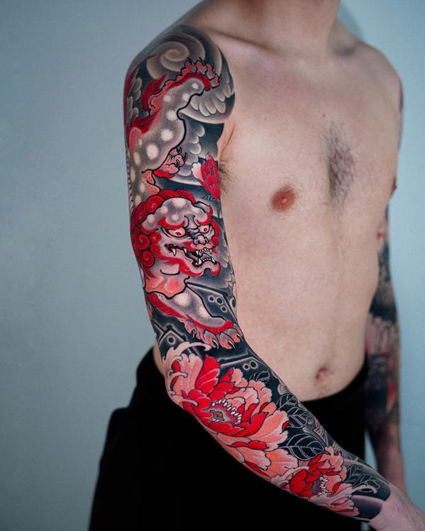 Foodog and peony sleeve tattoo