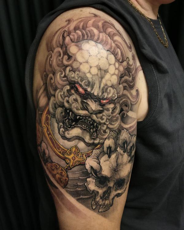 Foodog and skull tattoo
