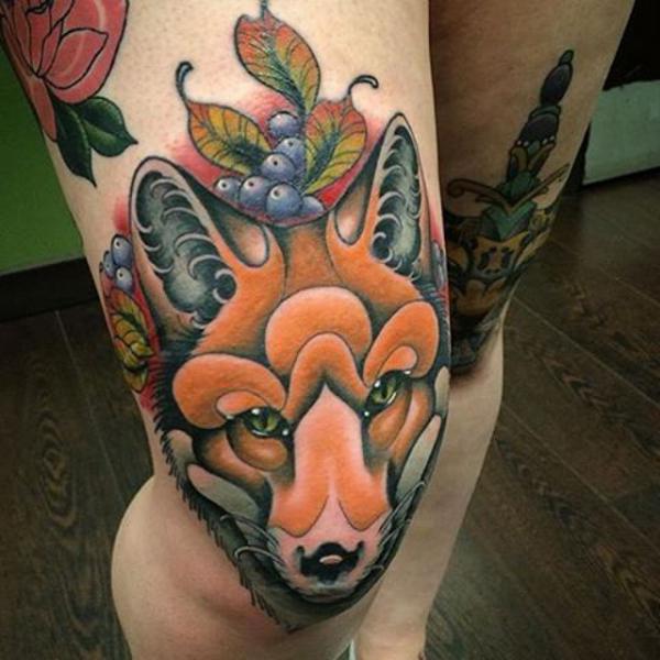 Fox tattoo above knee