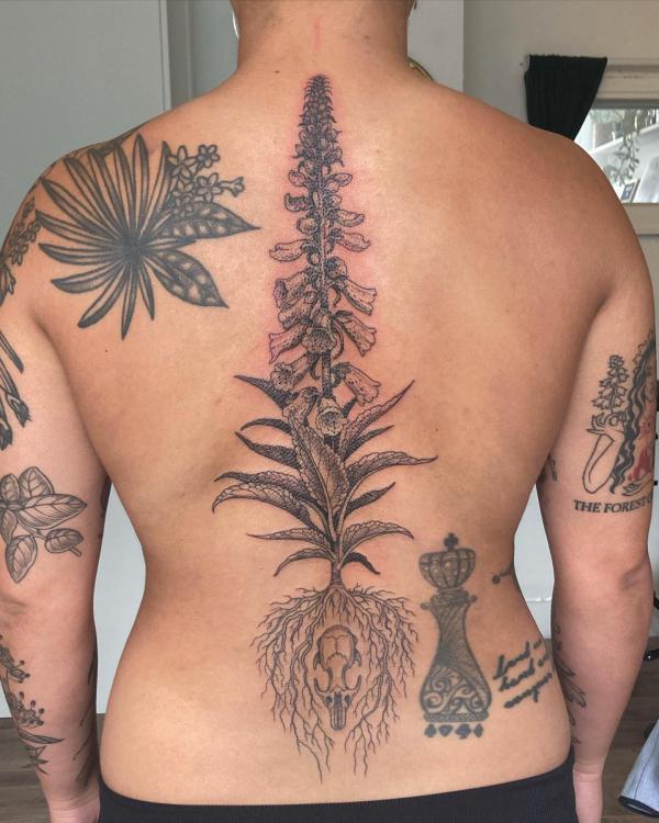 Foxglove back tattoo