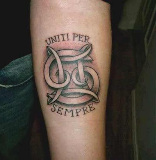 Gemini and cancer tattoo with phrase Uniti per Sempre