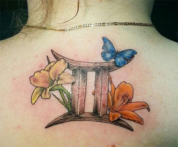 Gemini and lily with blue butterfly tattoo