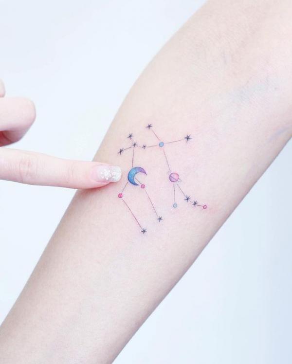 Gemini constellation with planet and crescent moon tattoo
