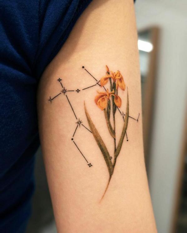 Gemini constellation with yellow iris tattoo