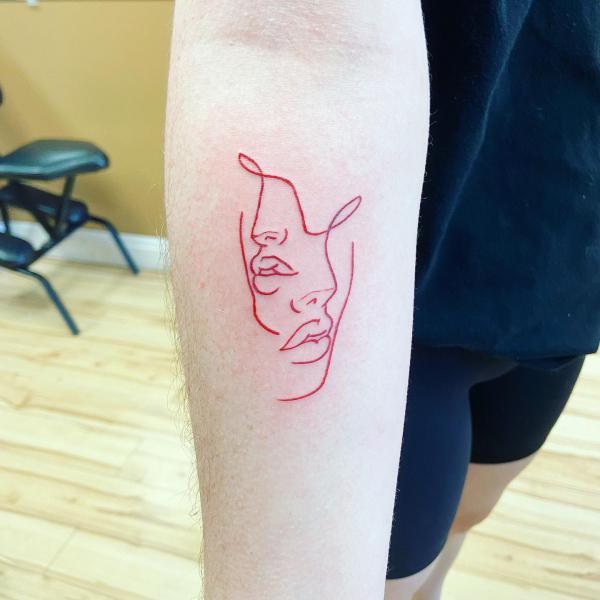 Gemini face line work tattoo