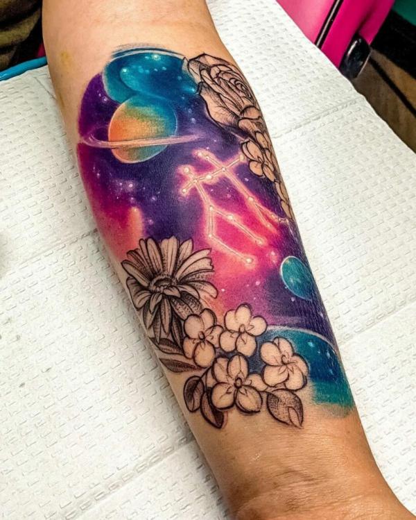 Gemini galaxy with constellation and flowers tattoo