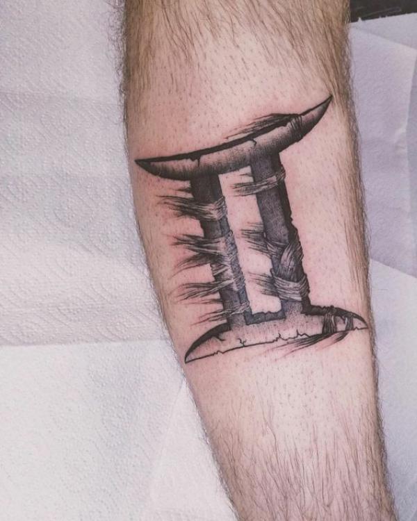 Gemini glyph tattoo on arm