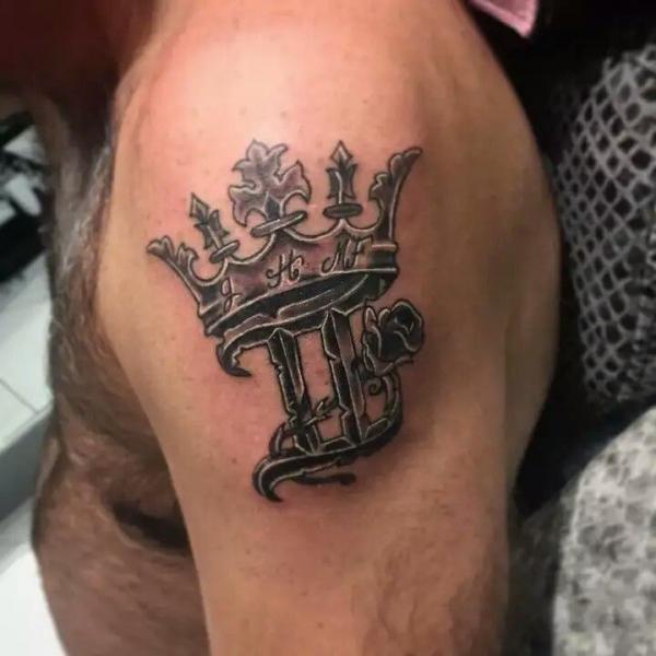 Gemini glyph with crown tattoo