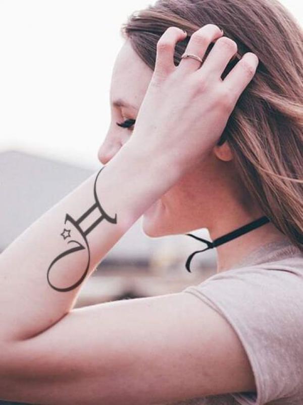 Gemini glyph with star tattoo