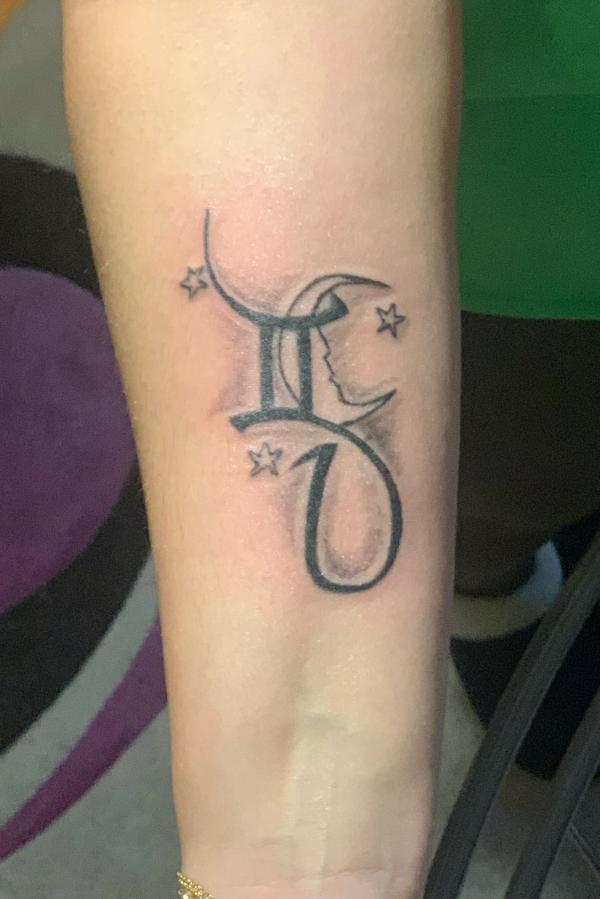 Gemini glyph with stars forearm tattoo