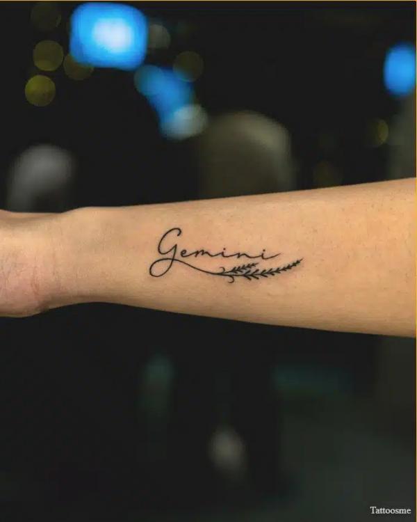 Gemini lettering forearm tattoo