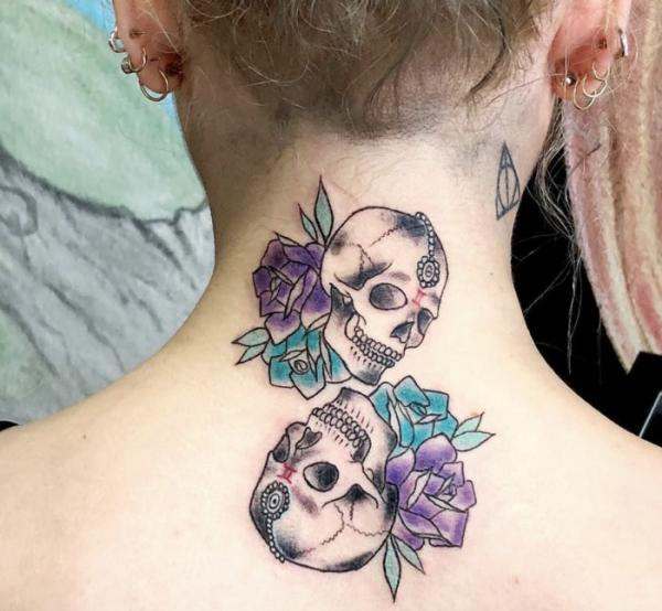 Gemini skull twin with roses tattoo