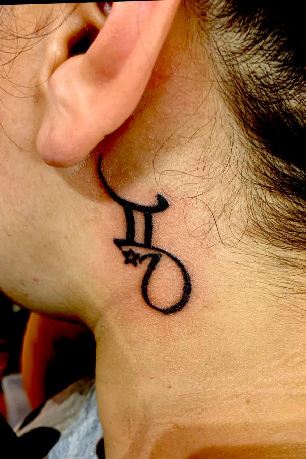 Gemini tattoo behind ear