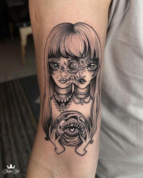 Gemini twin holding eye tattoo