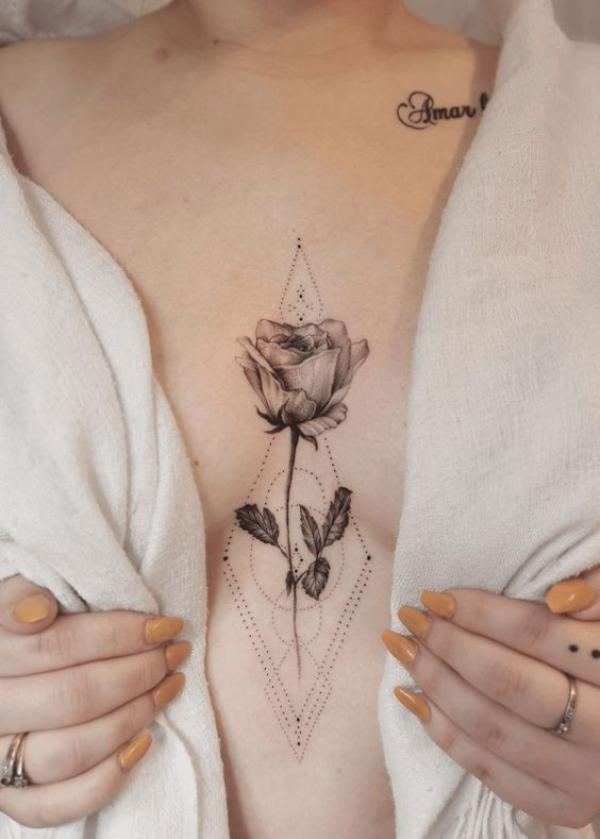 Geometric rose sternum tattoo black and grey