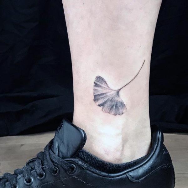 Ginkgo leaf ankle tattoo black and grey