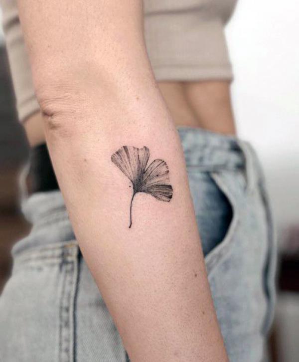 Ginkgo leaf tattoo below the elbow