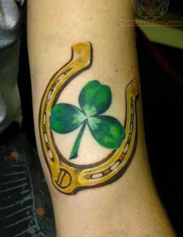 Gold horseshoe and clover tattoo