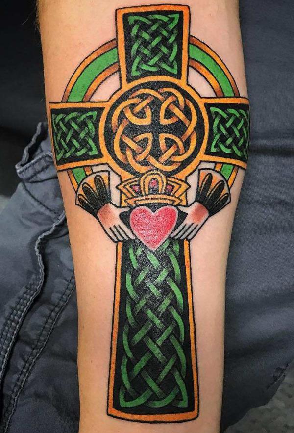 Golden yelllow and black Celtic cross with claddagh tattoo
