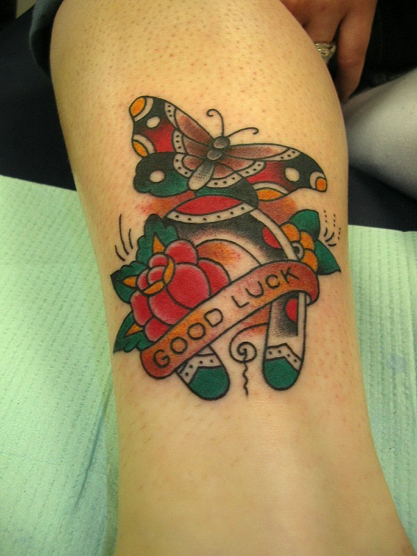 Good luck horseshoe with rose and butterfly tattoo traditional