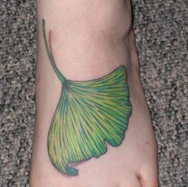Green ginkgo leaf foot tattoo